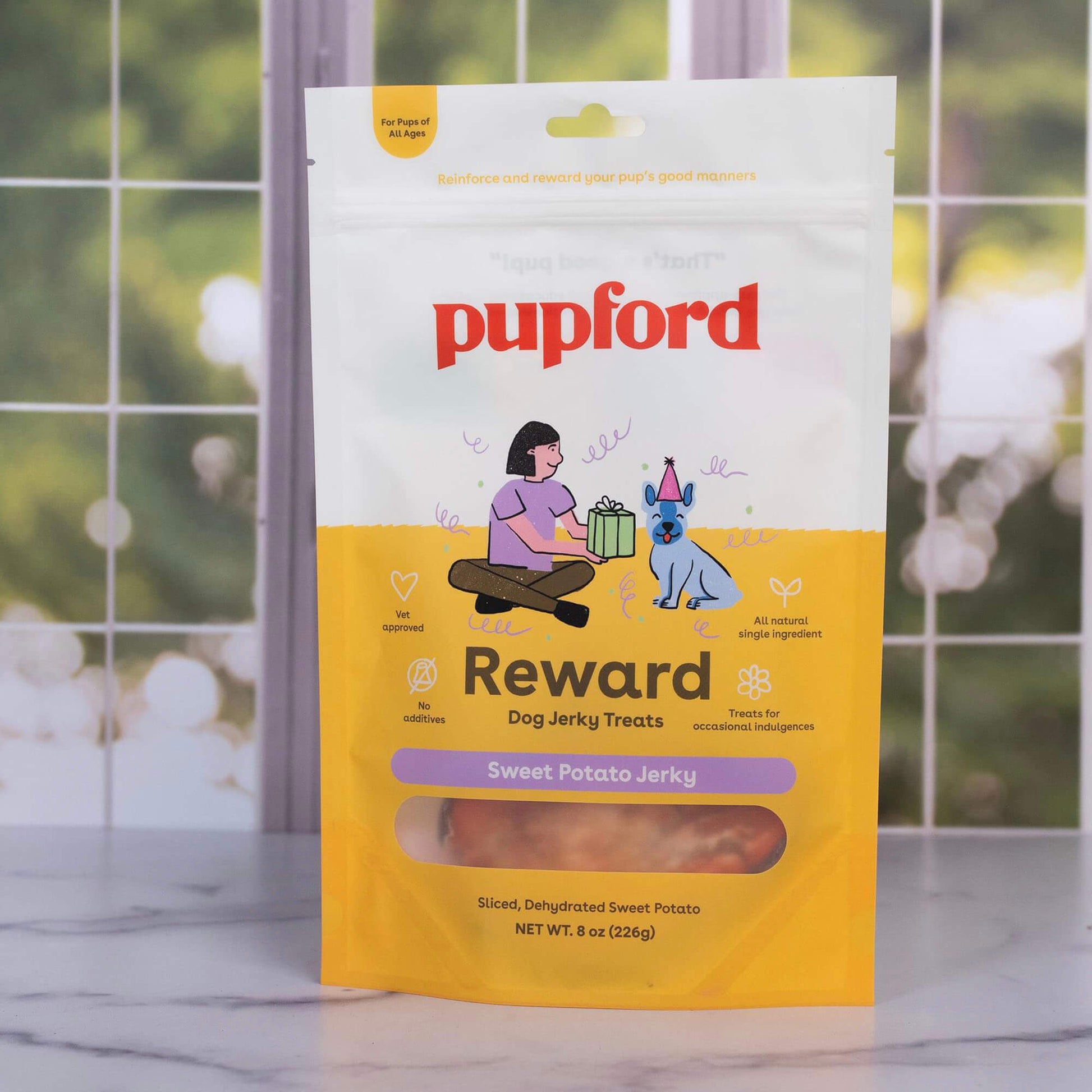 a bag of single ingredient sweet potato jerky treats in front of a window | Pupford
