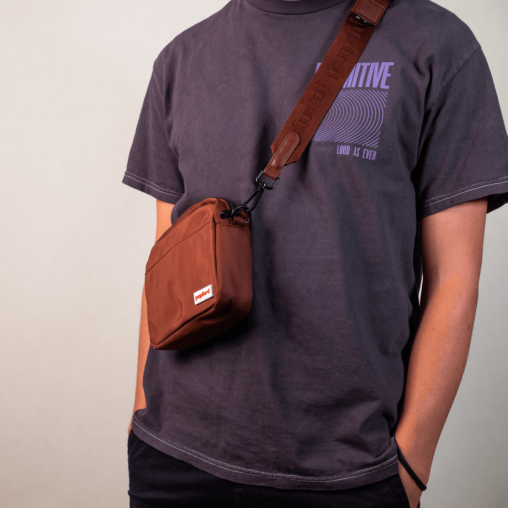 man carrying Brown training treat pouch
