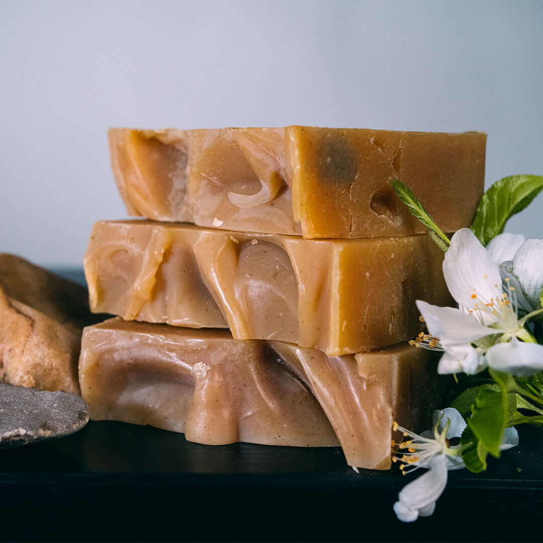 multiple bars of alpine meadow sudsy shampoo bars stacked on top of each other | Pupford 