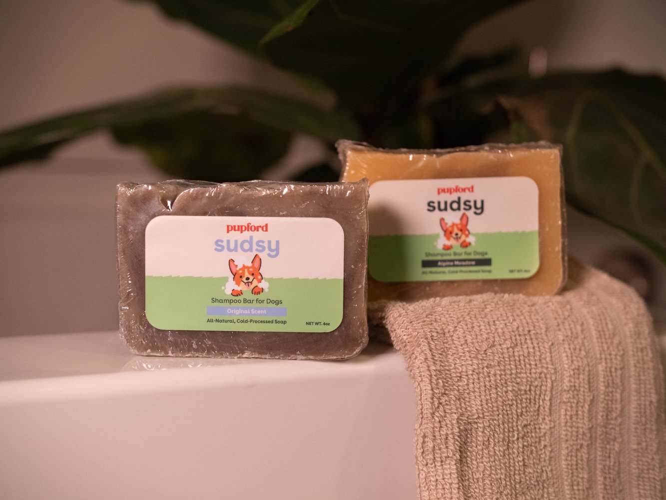 two scents of dog soap bars on the edge of a bath tub | Pupford
